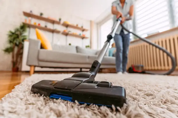 alt="Living room dusting and vacuuming service in Charleston SC"